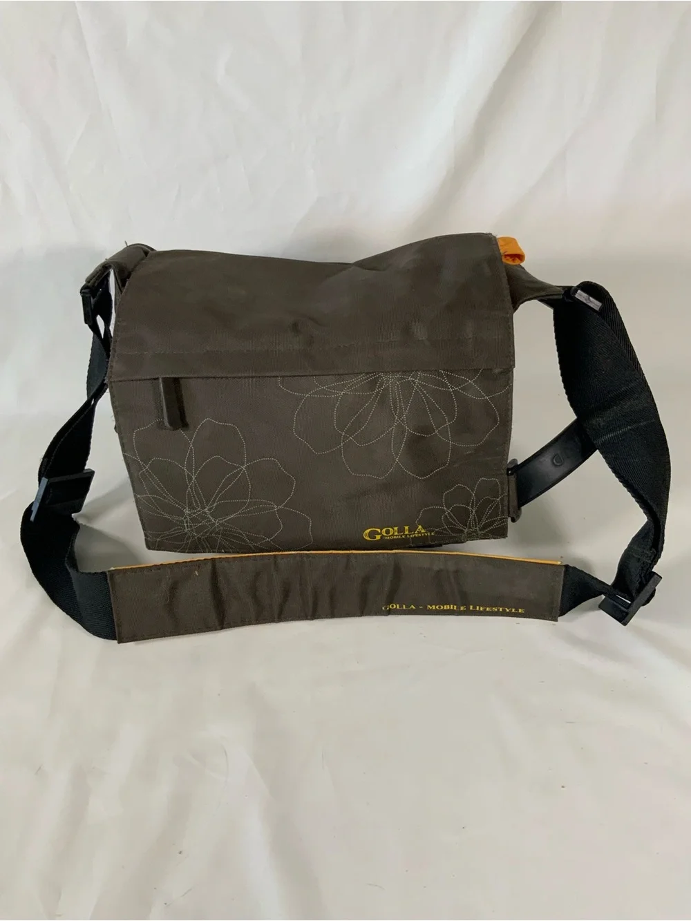 Nikon DSLR Camera with Black Body and Yellow-Orange Interior Bag